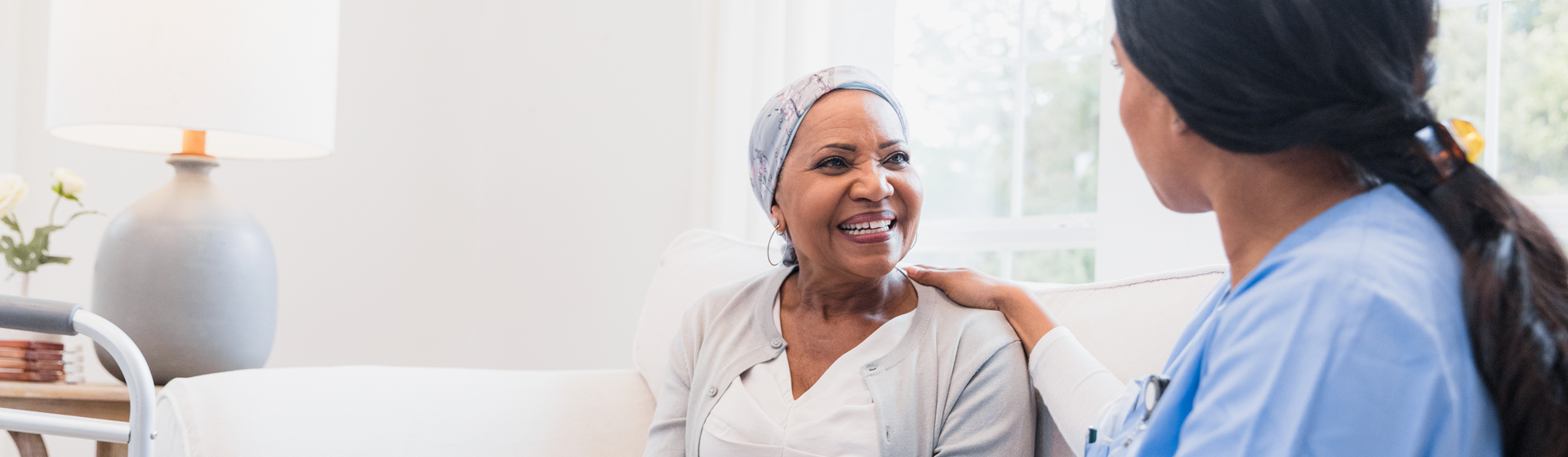 Health care professional with a patient at home