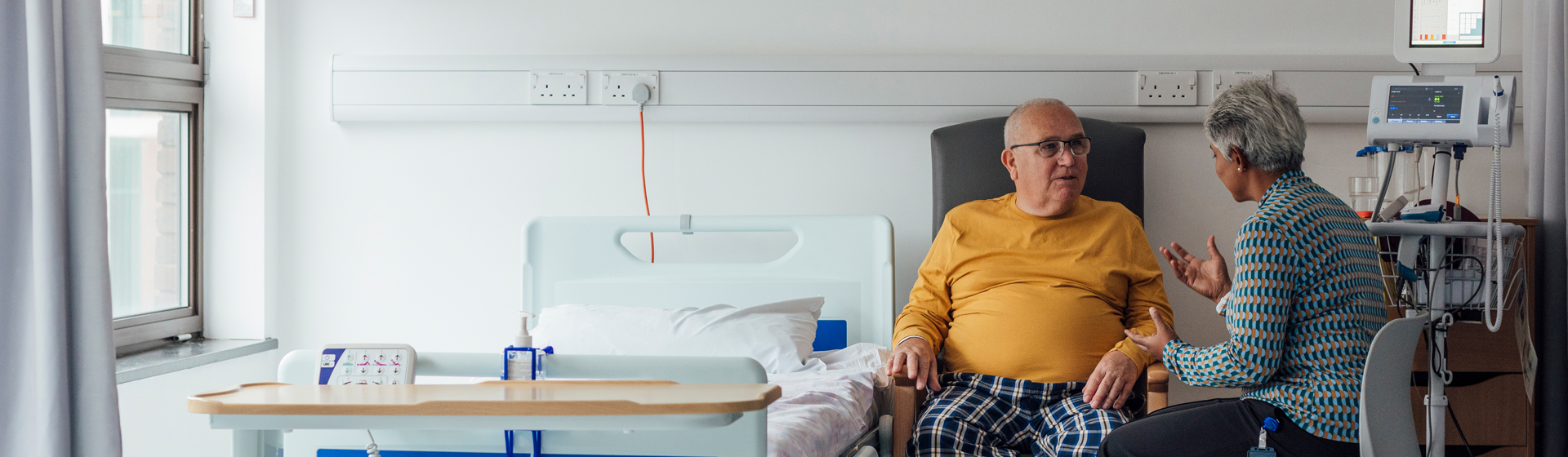 Critical care patient with family member in hospital