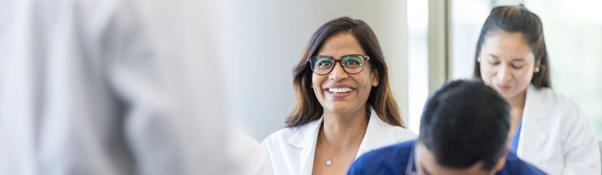 Physicians participate in an education and training program