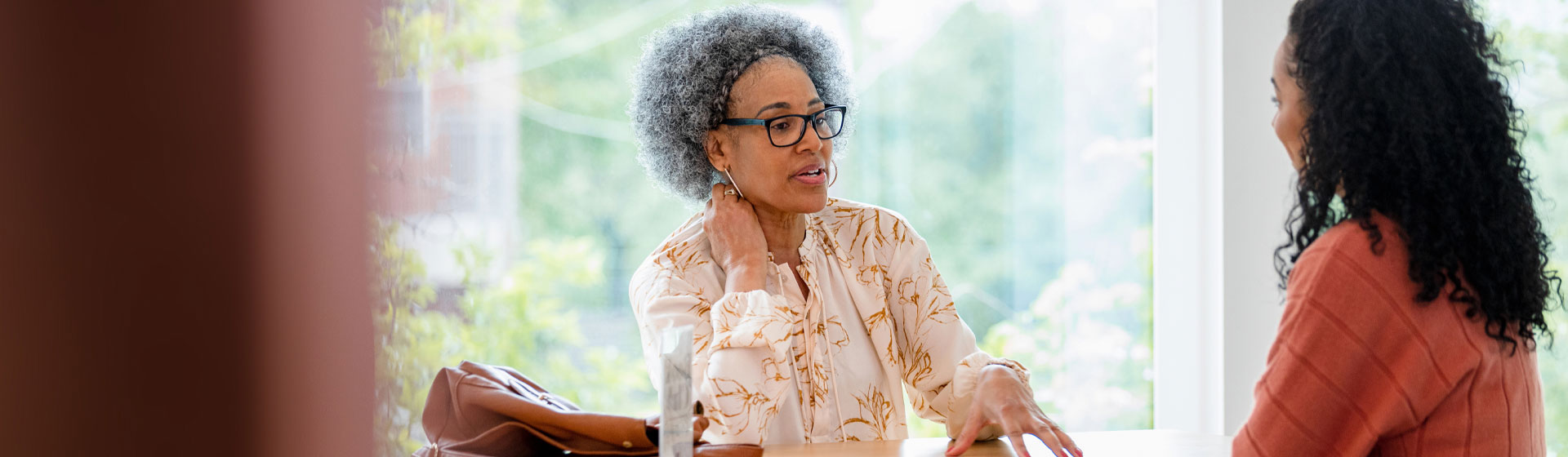 Two women talking at a table