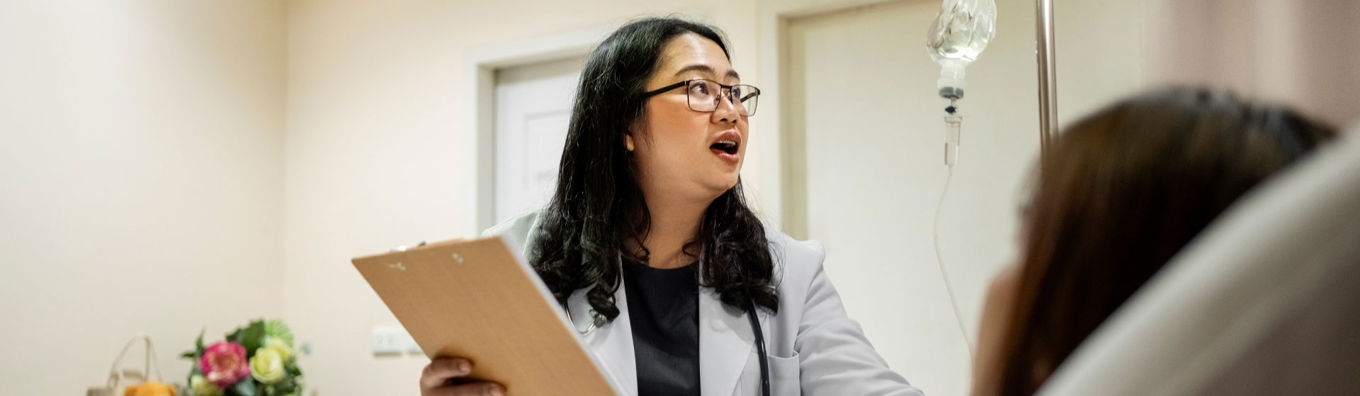 Doctor talking to patient at a hospital