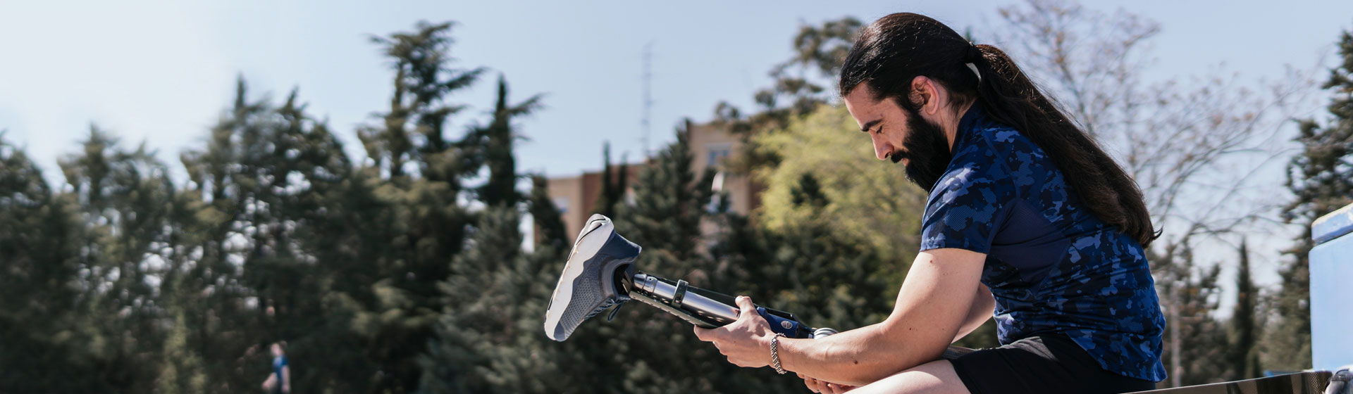 Man putting an amputee leg on