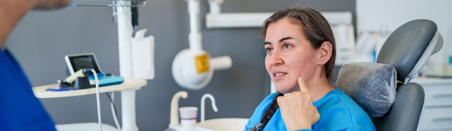 Patient pointing to their mouth