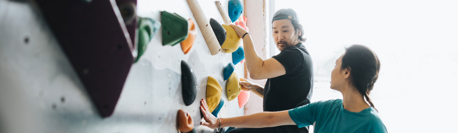 Two people rock climbing