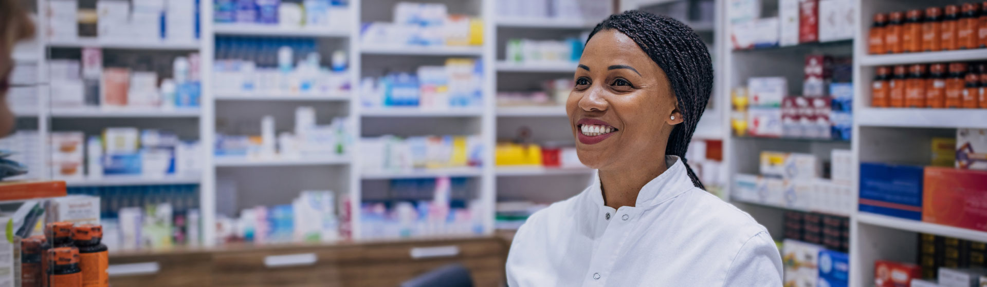 Female pharmacist helping a patient