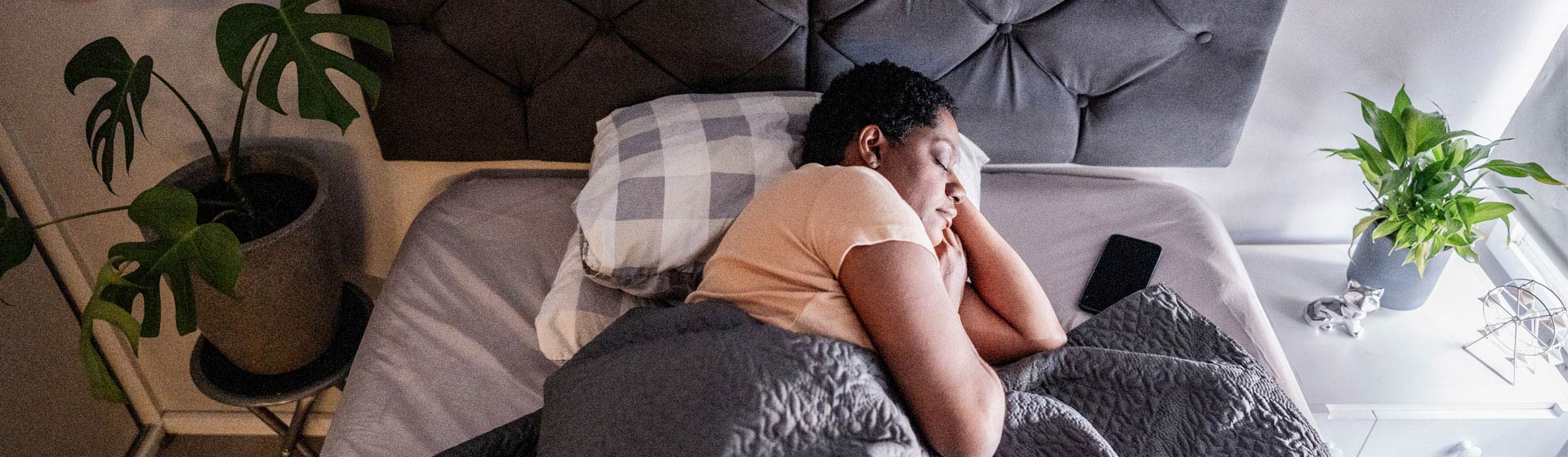 Woman sleeping in her bed