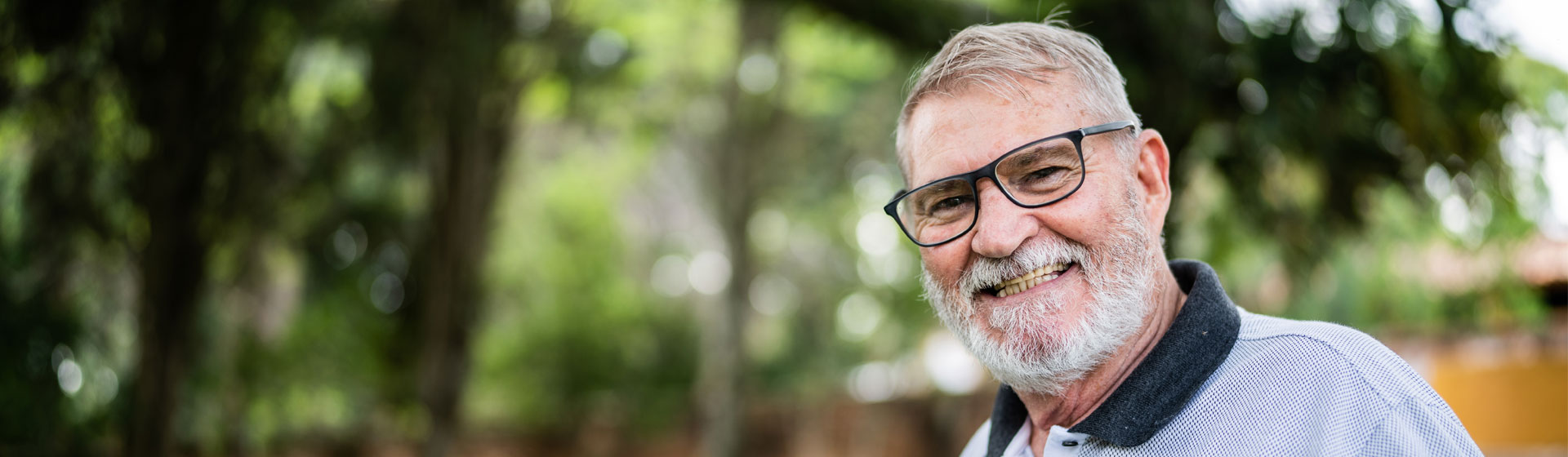 An elderly man smiling
