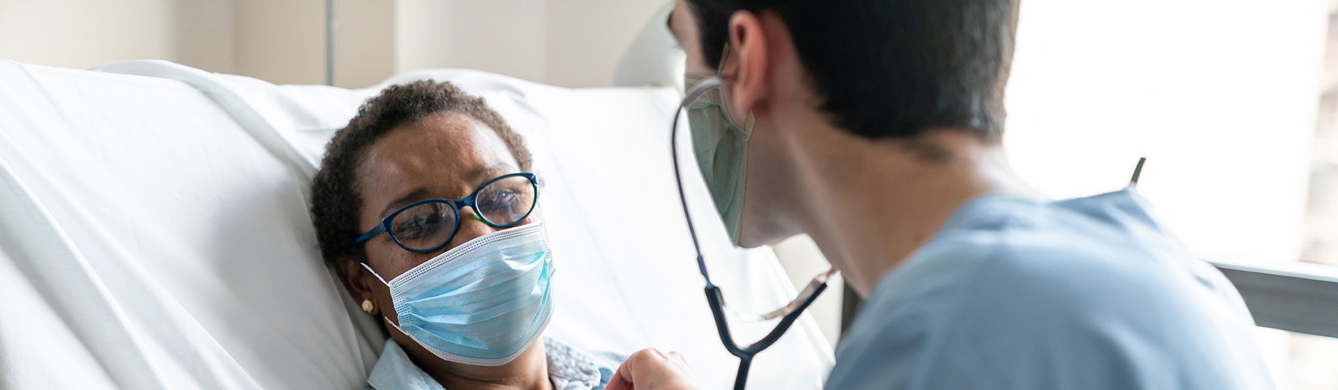 Masked patient with doctor