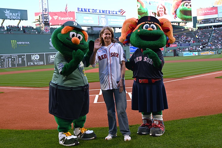 Dr. Elizabeth Mittendorf stands on the field at Fenway Park.