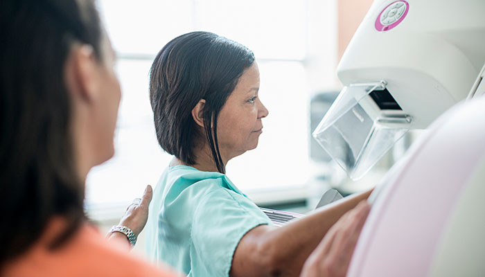 Female patient prepares for annual mammogram