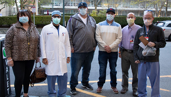 BIDMC trauma surgeons Alok Gupta, MD, Michael Yaffe, MD, and Charles Cook, MD with members of the Norden family