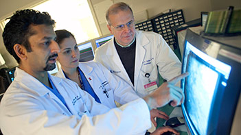 Drs. Duane Pinto and Donald Cutlip with a fellow