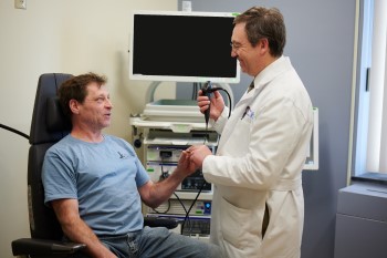 BIDMC Otolargyologist Examines Patient