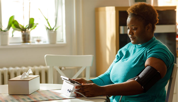 woman taking her blood pressure