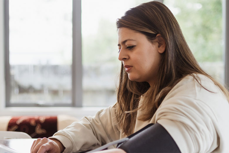 Woman checking her pulse