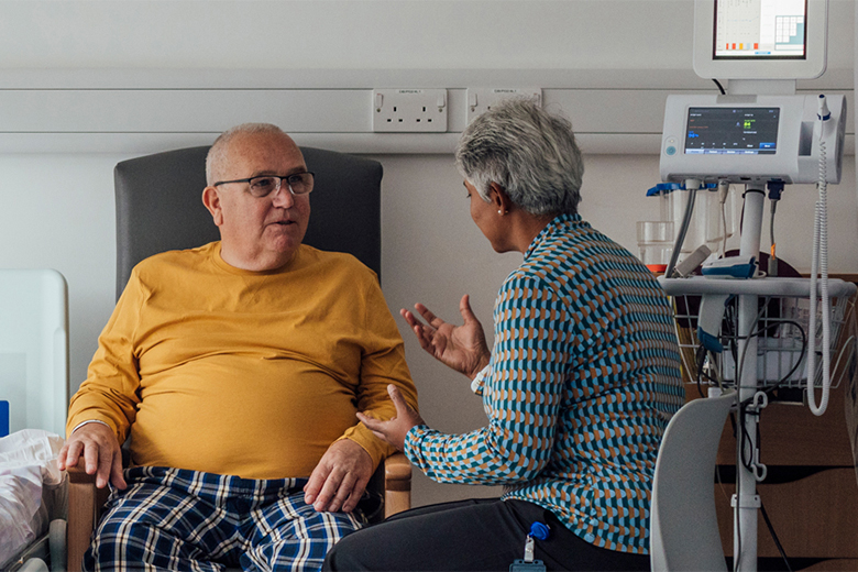 Critical care patient with family member in hospital