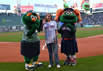 Dr. Elizabeth Mittendorf stands on the field at Fenway Park.