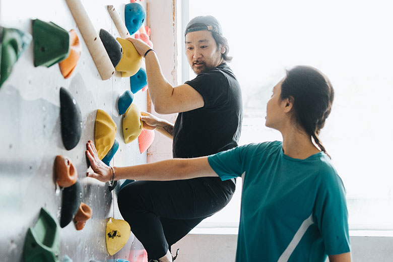 Two people rock climbing