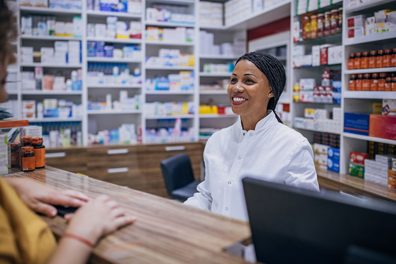 Female pharmacist helping a patient