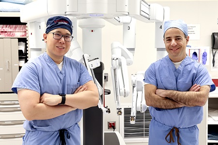 Drs. Chang and Wagner stand in front of RPLND equipment.