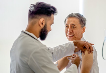 Man getting vaccine at doctors office