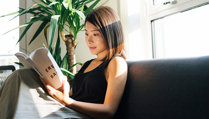 Woman reading on couch Woman reading on couch